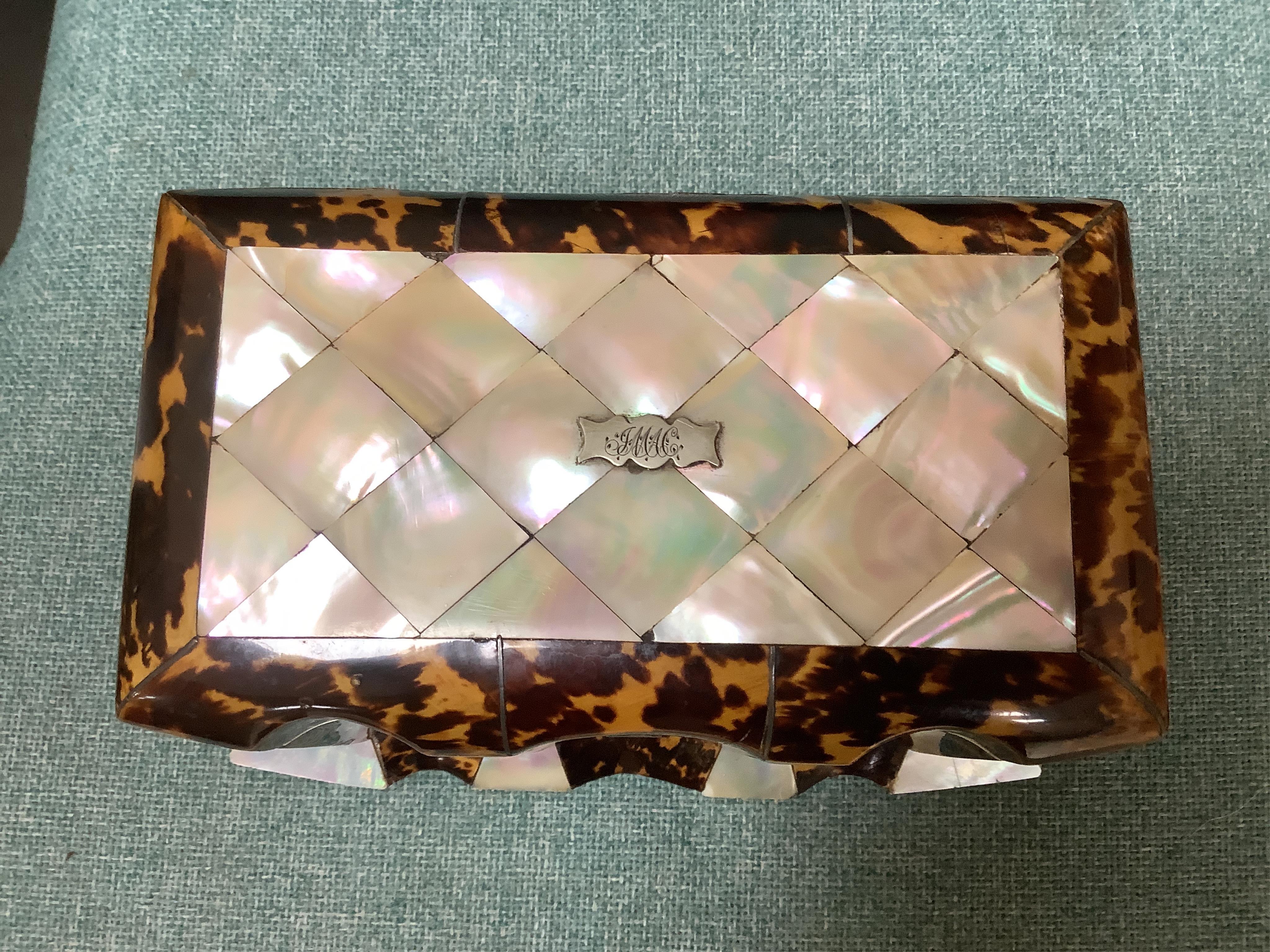 A mid 19th century decorative tortoiseshell and mother of pearl tea caddy, 20cm wide x 12.5cm high CITES Submission reference CXXC25Q1